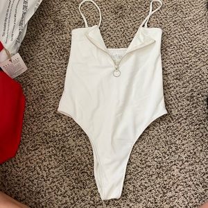 Frankie’s white one piece swimsuit